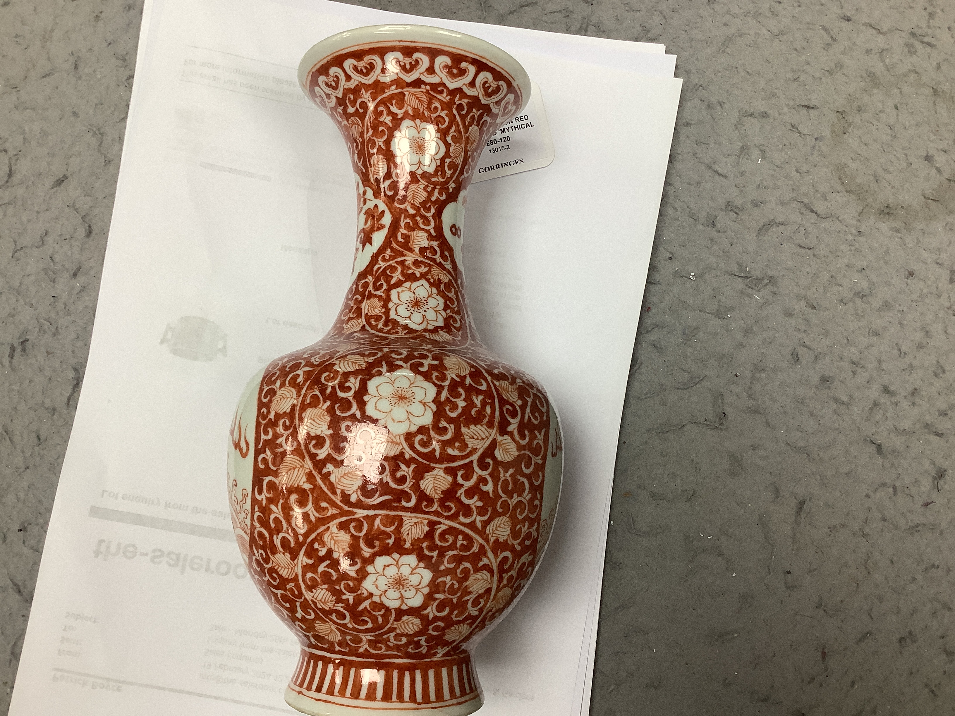 A Chinese iron red enamelled 'mythical beast' vase, early 20th century, 21cm high
